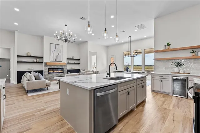 a living room with fireplace furniture and a wooden floor