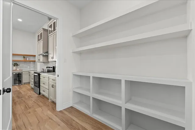 a view of a storage and utility room with closet