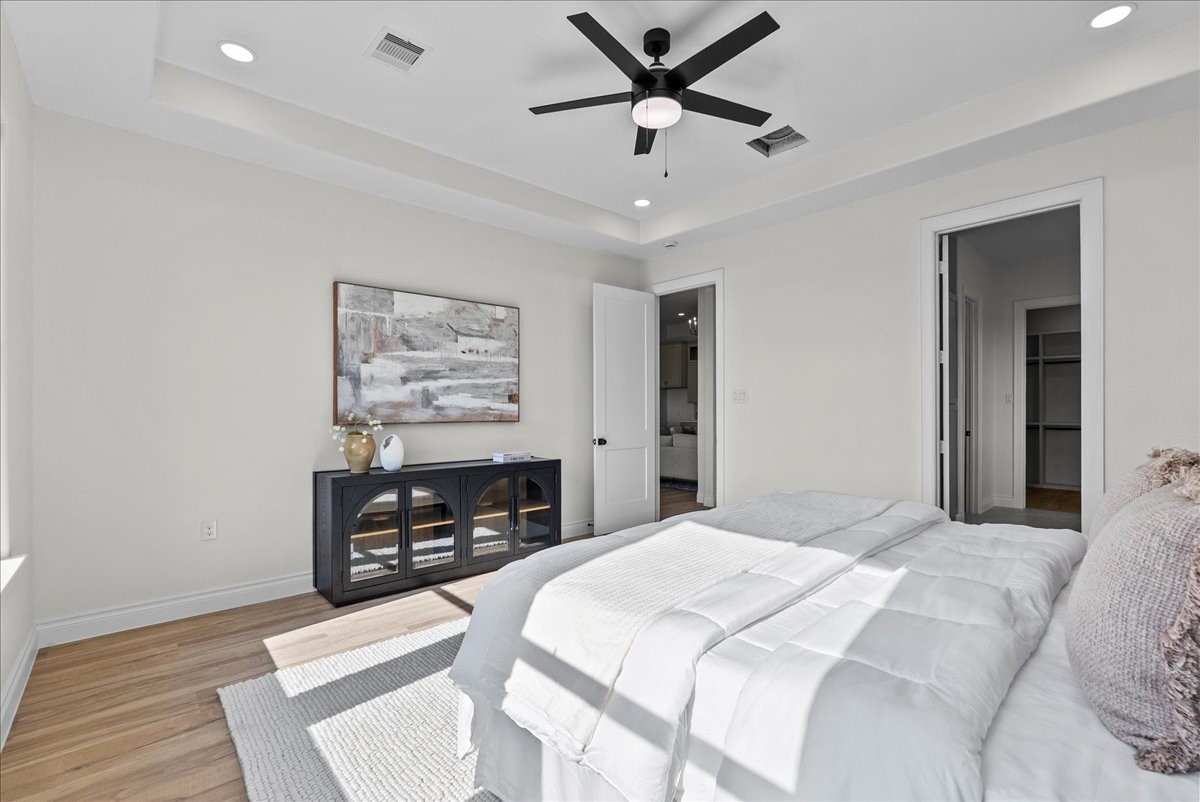 224 Cripple Creek Lane Angleton, TX 77515 - Photo 25 of 38 a bedroom with a bed and a painting on the wall