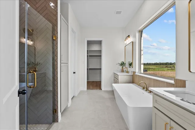a bathroom with a glass shower door