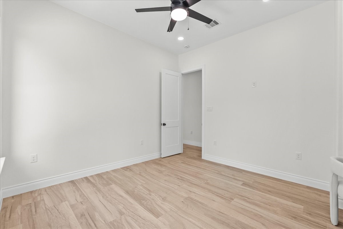224 Cripple Creek Lane Angleton, TX 77515 - Photo 31 of 38 wooden floor in an empty room