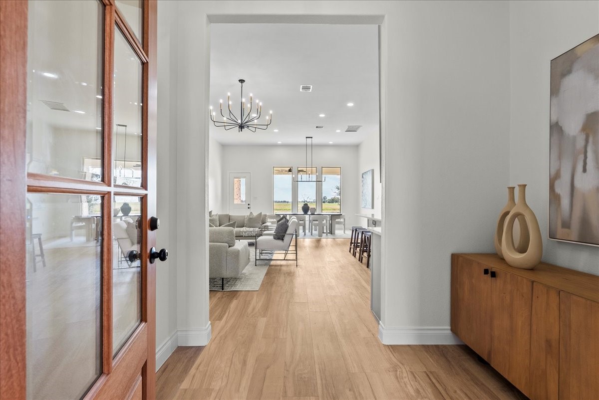224 Cripple Creek Lane Angleton, TX 77515 - Photo 6 of 38 a view of a bathroom from the hallway