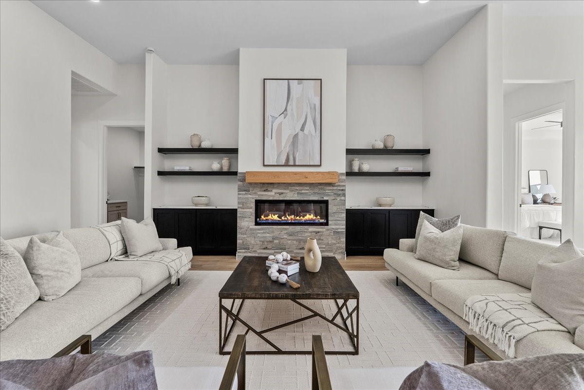 224 Cripple Creek Lane Angleton, TX 77515 - Photo 7 of 38 a living room with furniture and a fireplace