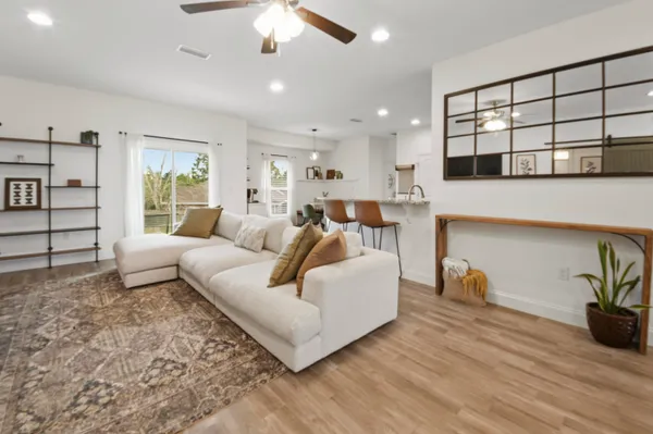 a living room with furniture and a large window