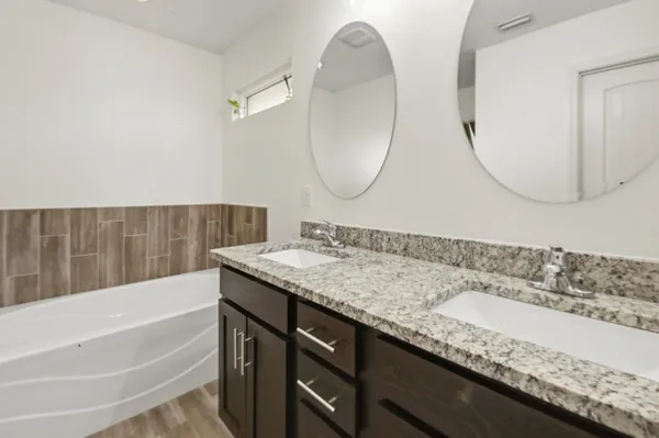 a bathroom with a bathtub and shower