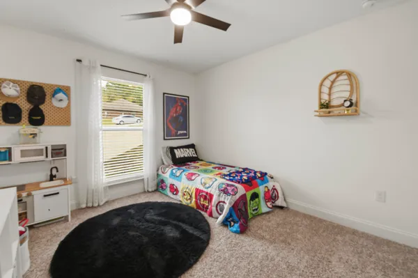 a bedroom with a bed and a table