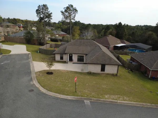 an aerial view of a house with pool