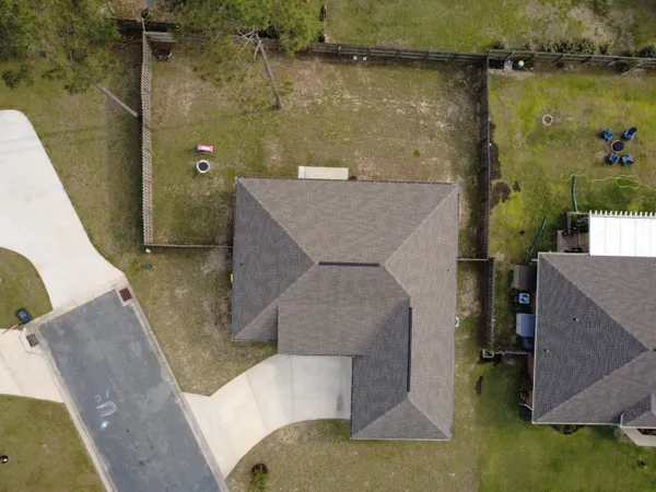 an aerial view of a house with outdoor space