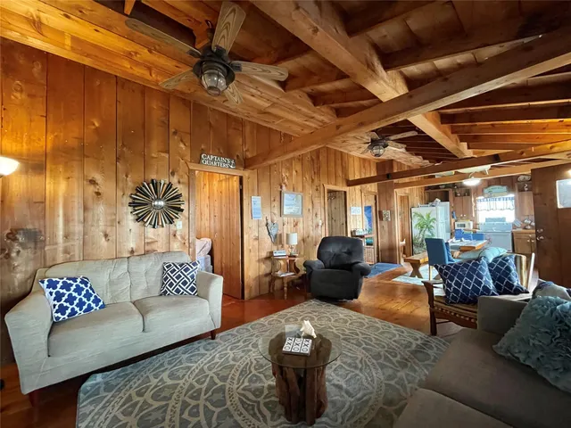 a kitchen with stainless steel appliances granite countertop a sink and wooden cabinets