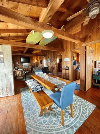 a outdoor space with a large pool table and chairs