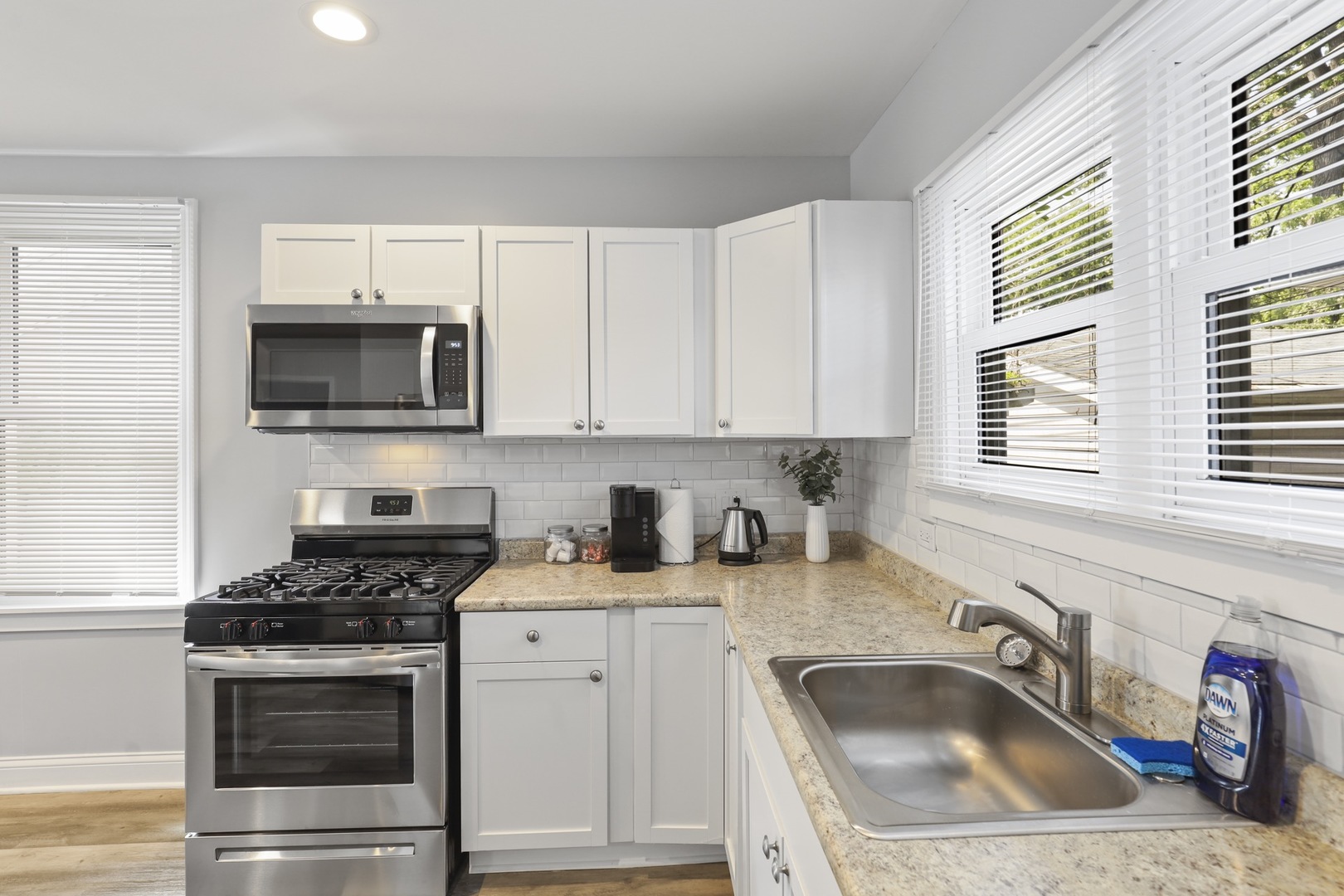 2446 North 1st Avenue River Grove, IL 60171 - Photo 13 of 31 a kitchen with sink a microwave and cabinets
