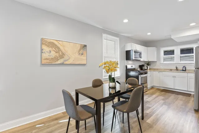 a dining room with furniture and window