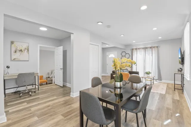 a view of a dining room with furniture window and wooden floor