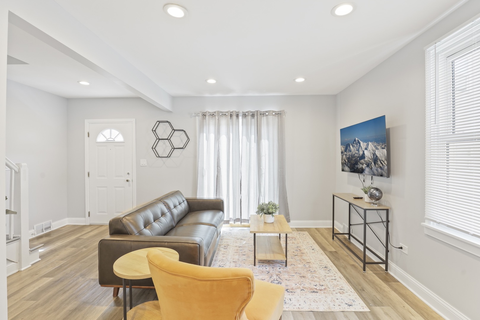 2446 North 1st Avenue River Grove, IL 60171 - Photo 19 of 31 a living room with furniture and a window