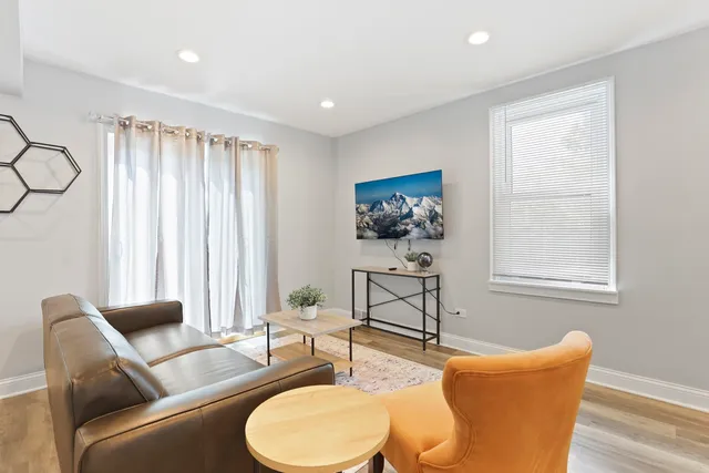a living room with furniture and a window