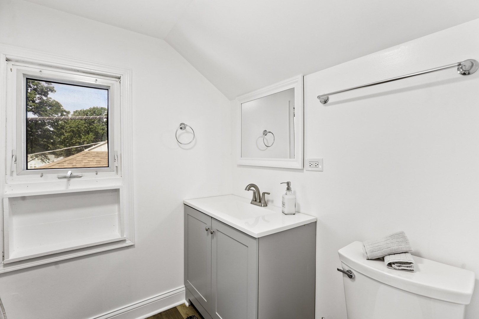 2446 North 1st Avenue River Grove, IL 60171 - Photo 5 of 31 a bathroom with a sink and a mirror