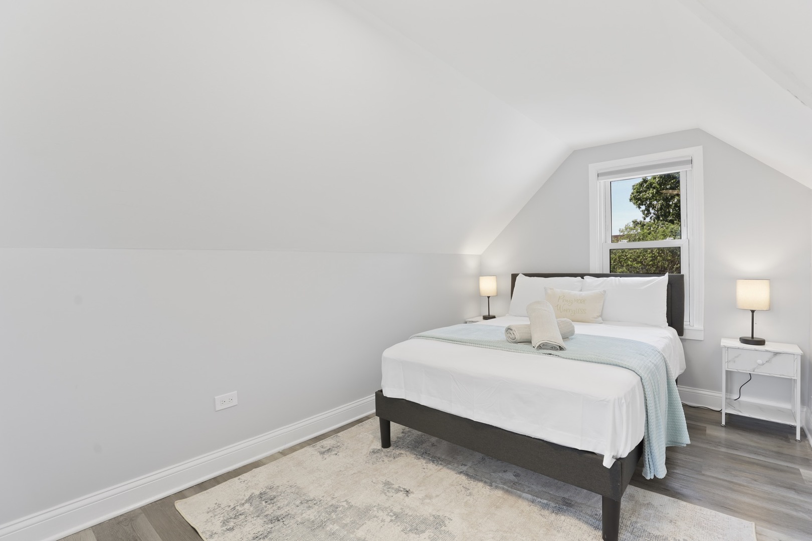 2446 North 1st Avenue River Grove, IL 60171 - Photo 8 of 31 a bedroom with a bed and a lamp