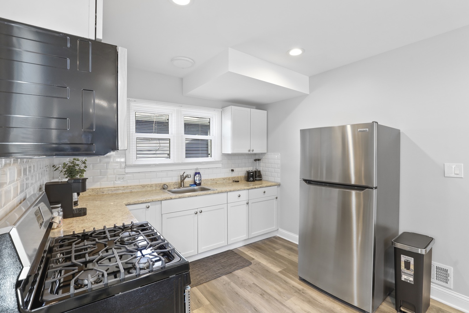 2446 North 1st Avenue River Grove, IL 60171 - Photo 10 of 31 a kitchen with a refrigerator and a sink