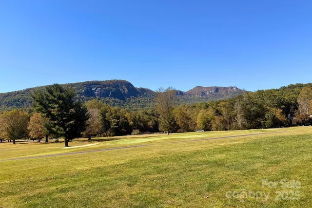 a view of an ocean with a mountain in the background
