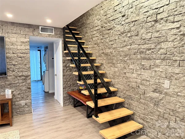 a view of entryway with wooden floor