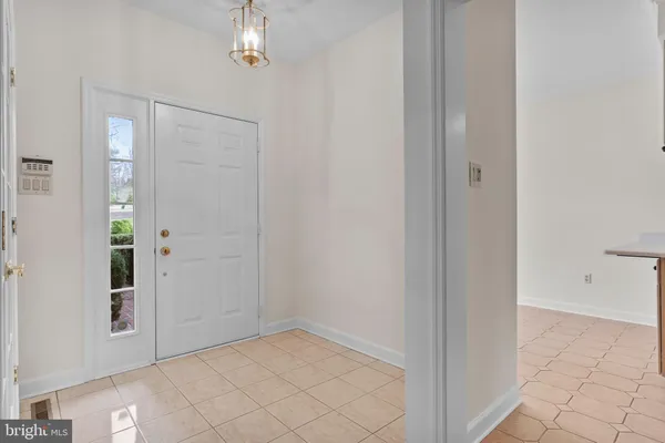 a view of staircase with white walls and railing