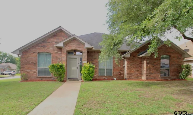 front view of a house with a yard