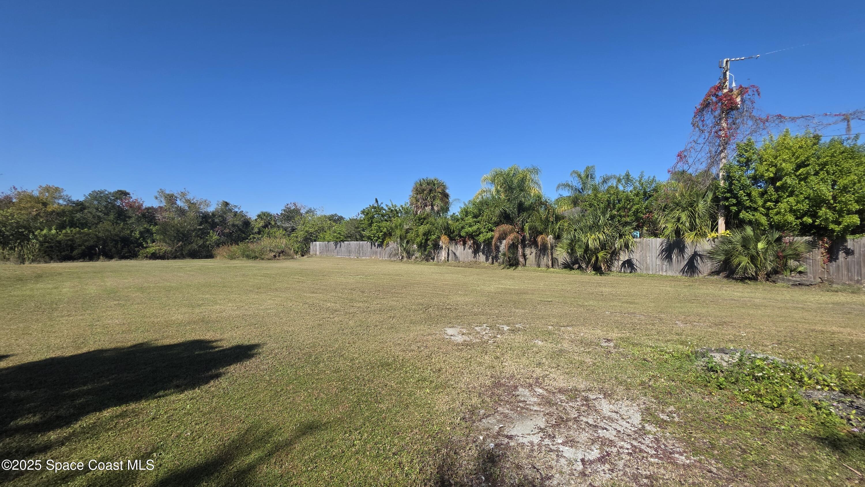 875 Pine Island Road Merritt Island, FL 32953 - Photo 7 of 24 a view of an ocean with a yard