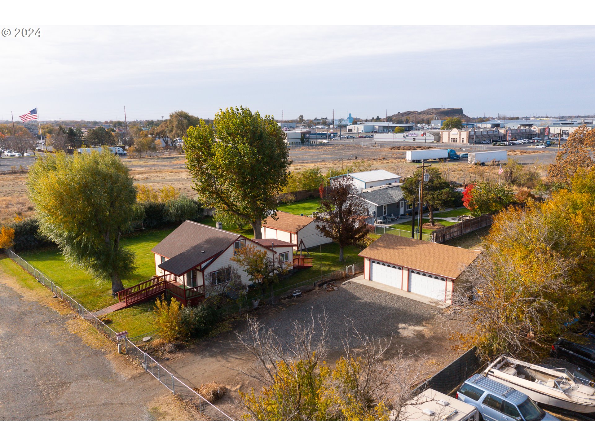 a view of a terrace with lawn chairs