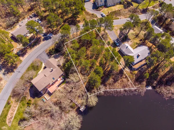 an aerial view of residential house with parking space