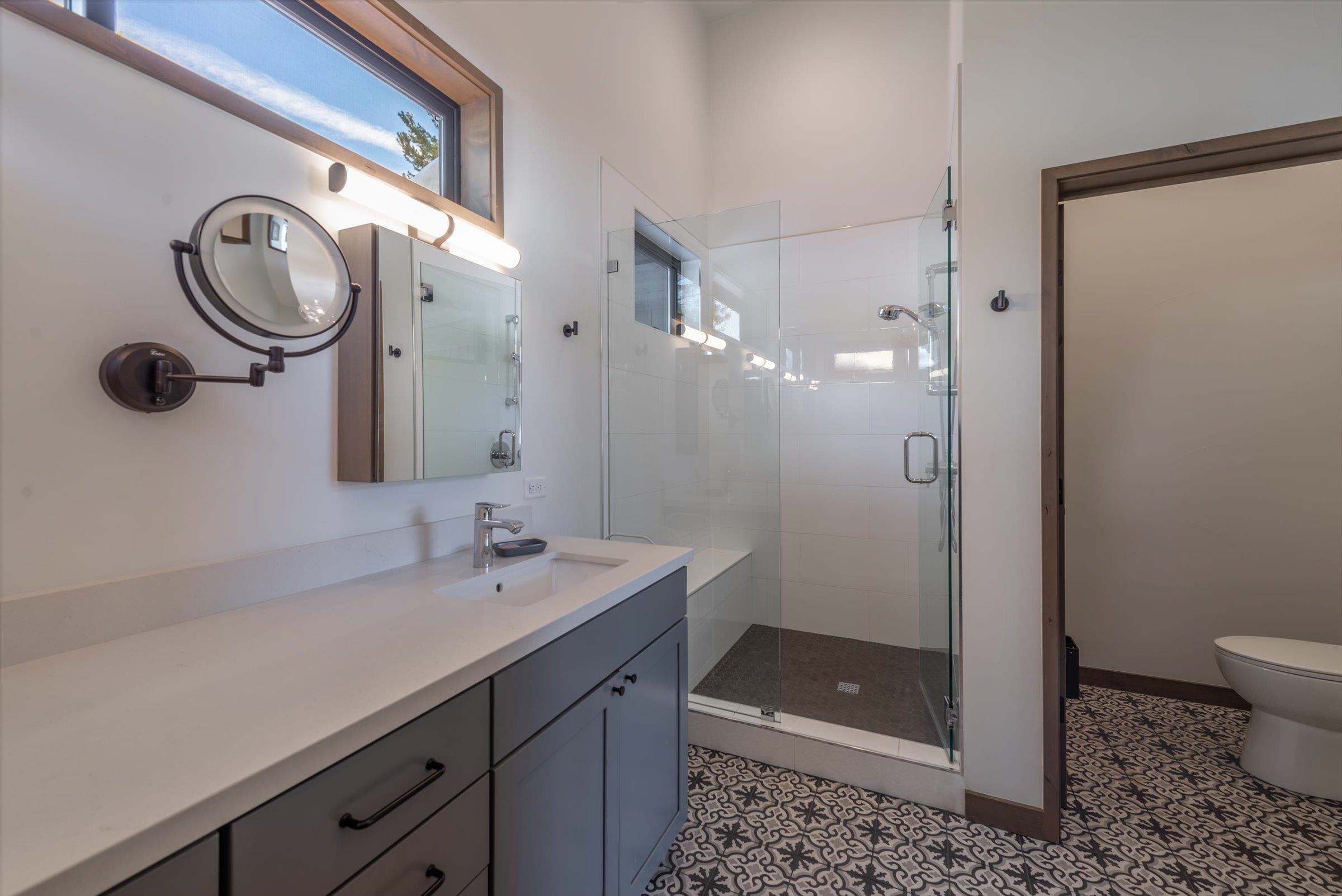 11530 Bennett Flat Road Truckee, CA 96161 - Photo 11 of 21 a bathroom with a shower a sink and a mirror