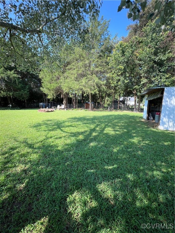 255 Rainwater Drive Aylett, VA 23009 - Photo 12 of 30 a view of a big yard with a large trees