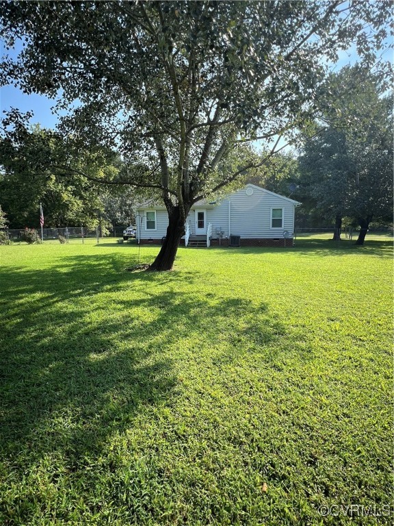 255 Rainwater Drive Aylett, VA 23009 - Photo 17 of 30 a backyard of a house with lots of green space