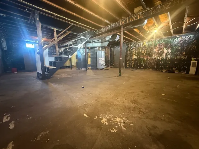 a view of empty room with wooden walls