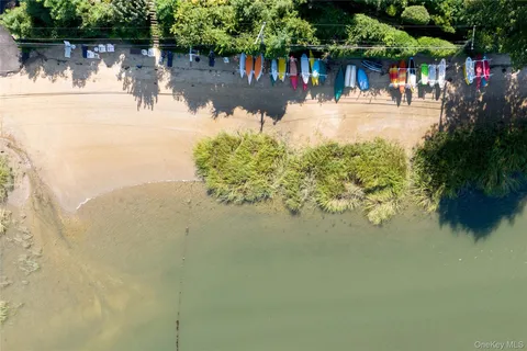 a view of a street with a building and a big yard