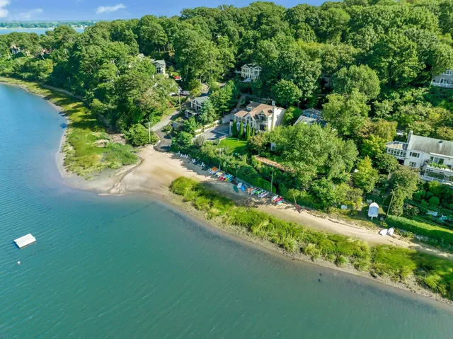 an aerial view of residential house with outdoor space and lake view