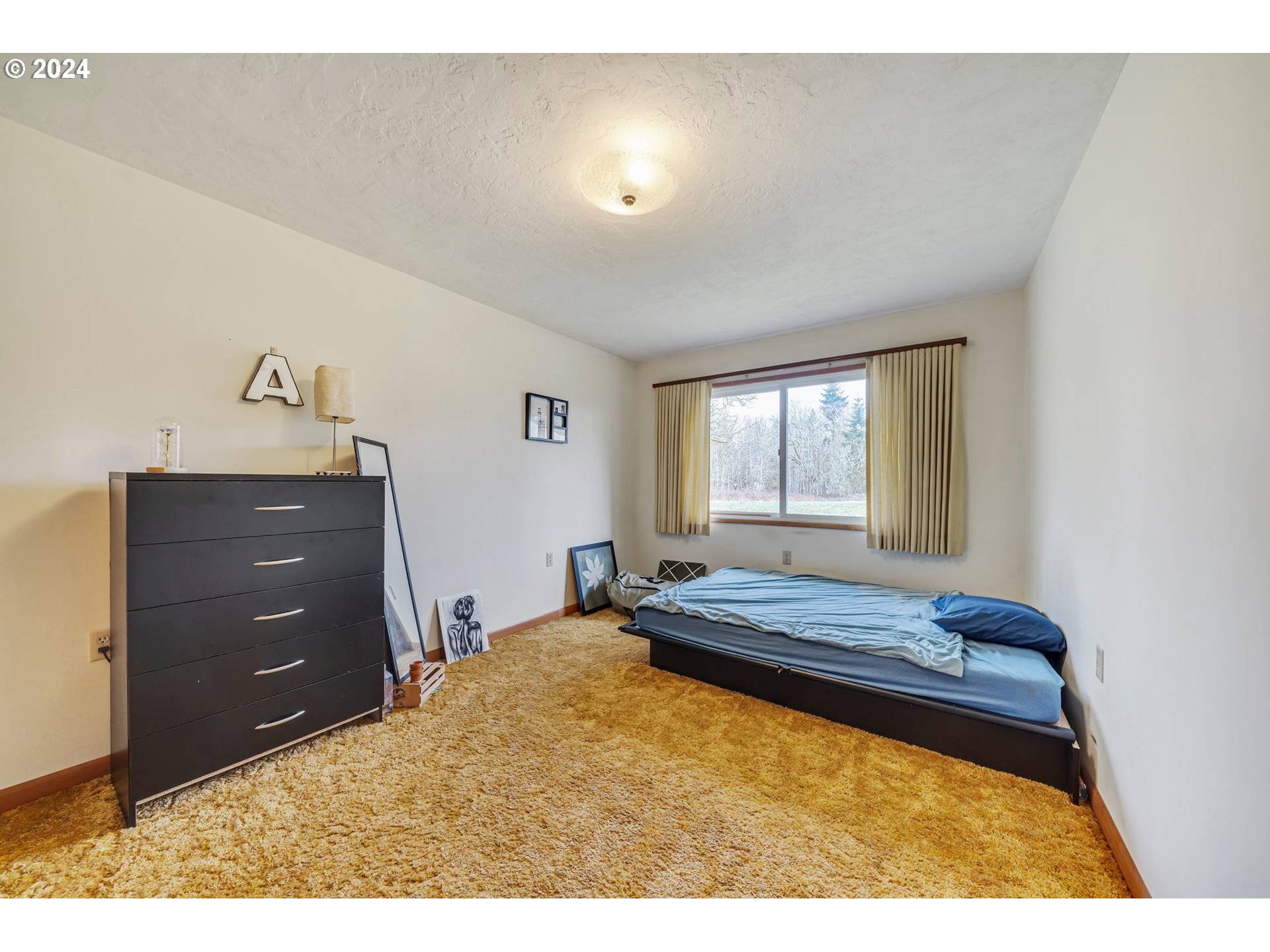 33821 Southeast Gunderson Road Sandy, OR 97055 - Photo 16 of 44 a bedroom with a bed and window