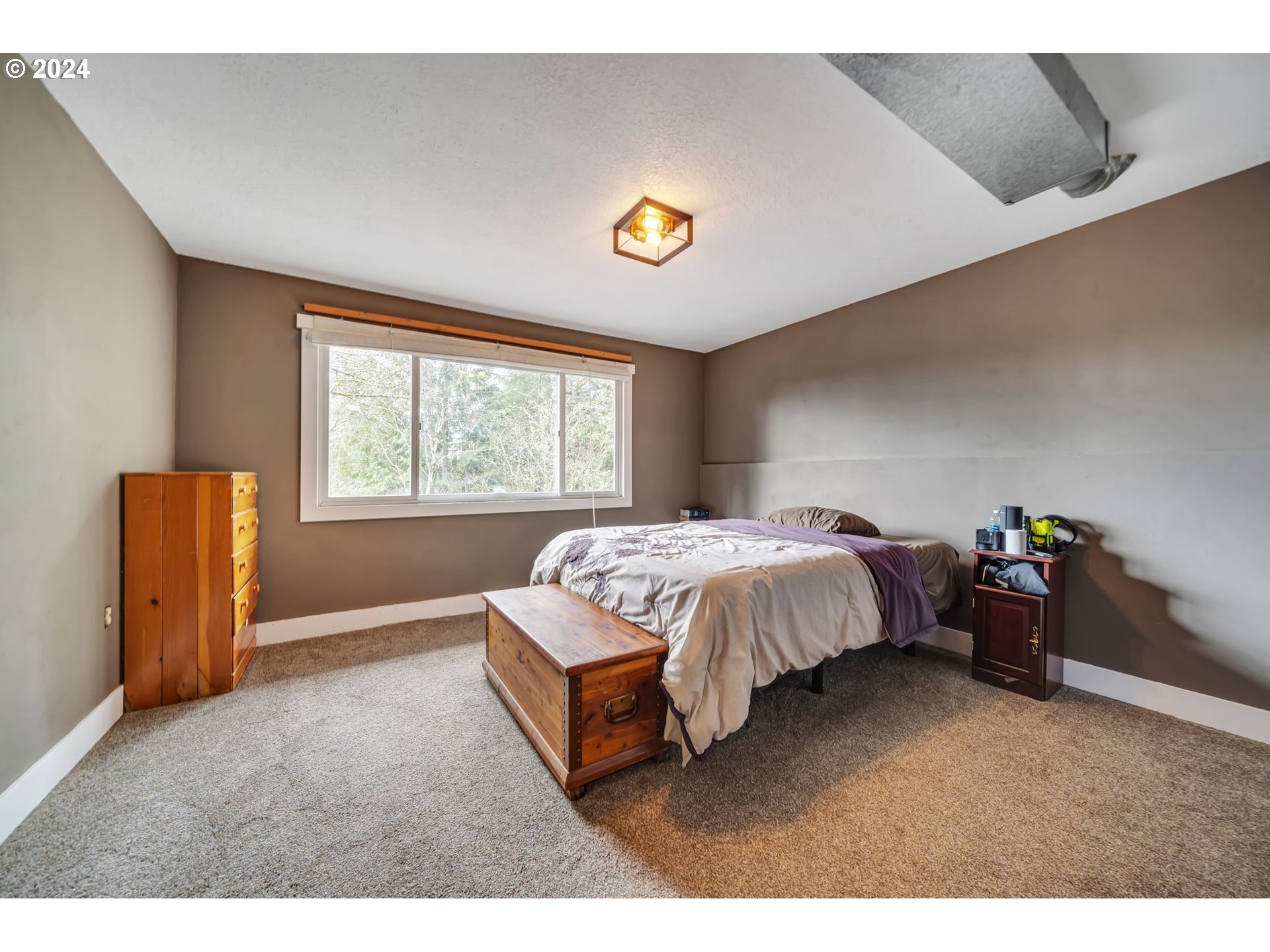 33821 Southeast Gunderson Road Sandy, OR 97055 - Photo 17 of 44 a spacious bedroom with a bed and a window