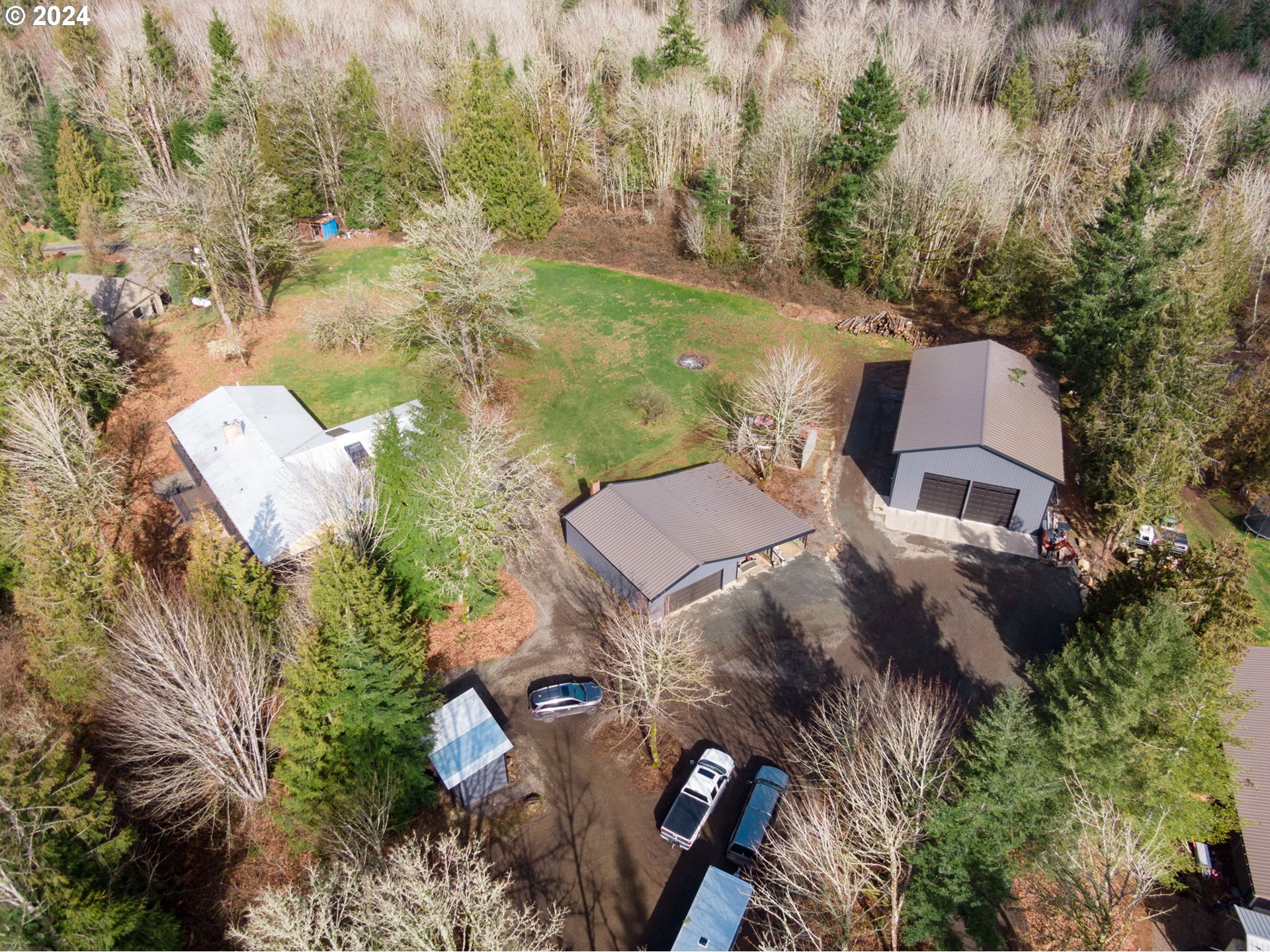 33821 Southeast Gunderson Road Sandy, OR 97055 - Photo 42 of 44 an aerial view of a house with a yard and lake view
