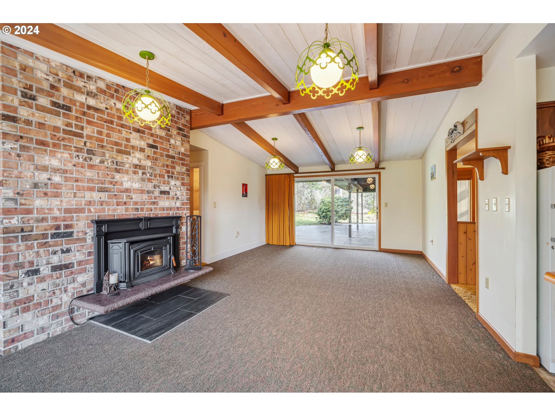 33821 Southeast Gunderson Road Sandy, OR 97055 - Photo 6 of 44 a view of empty room with a fireplace and windows