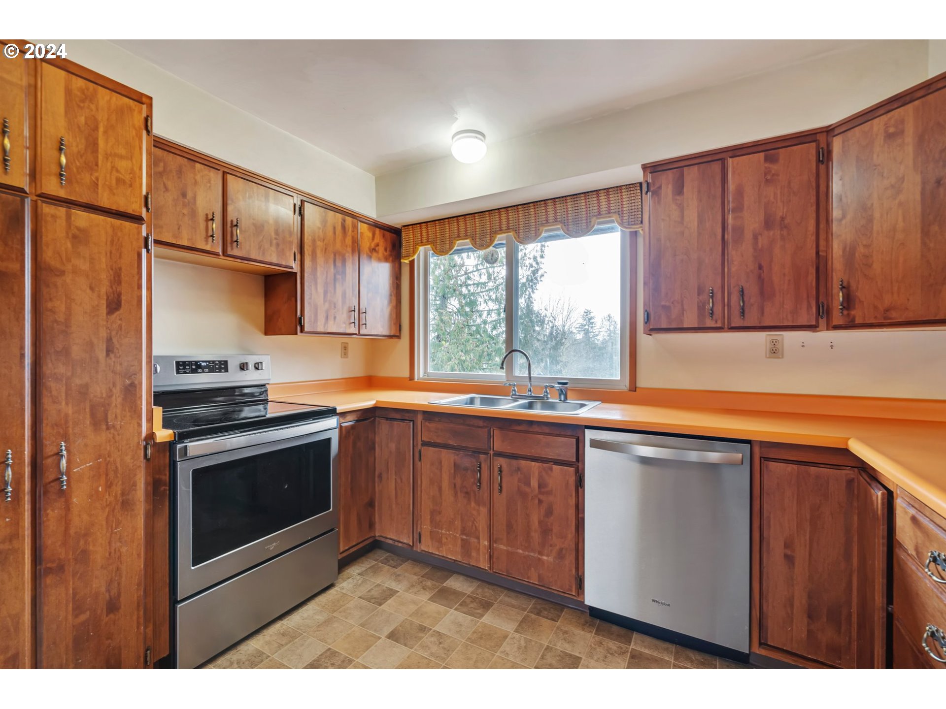 33821 Southeast Gunderson Road Sandy, OR 97055 - Photo 7 of 44 a kitchen with stainless steel appliances granite countertop a sink stove and microwave