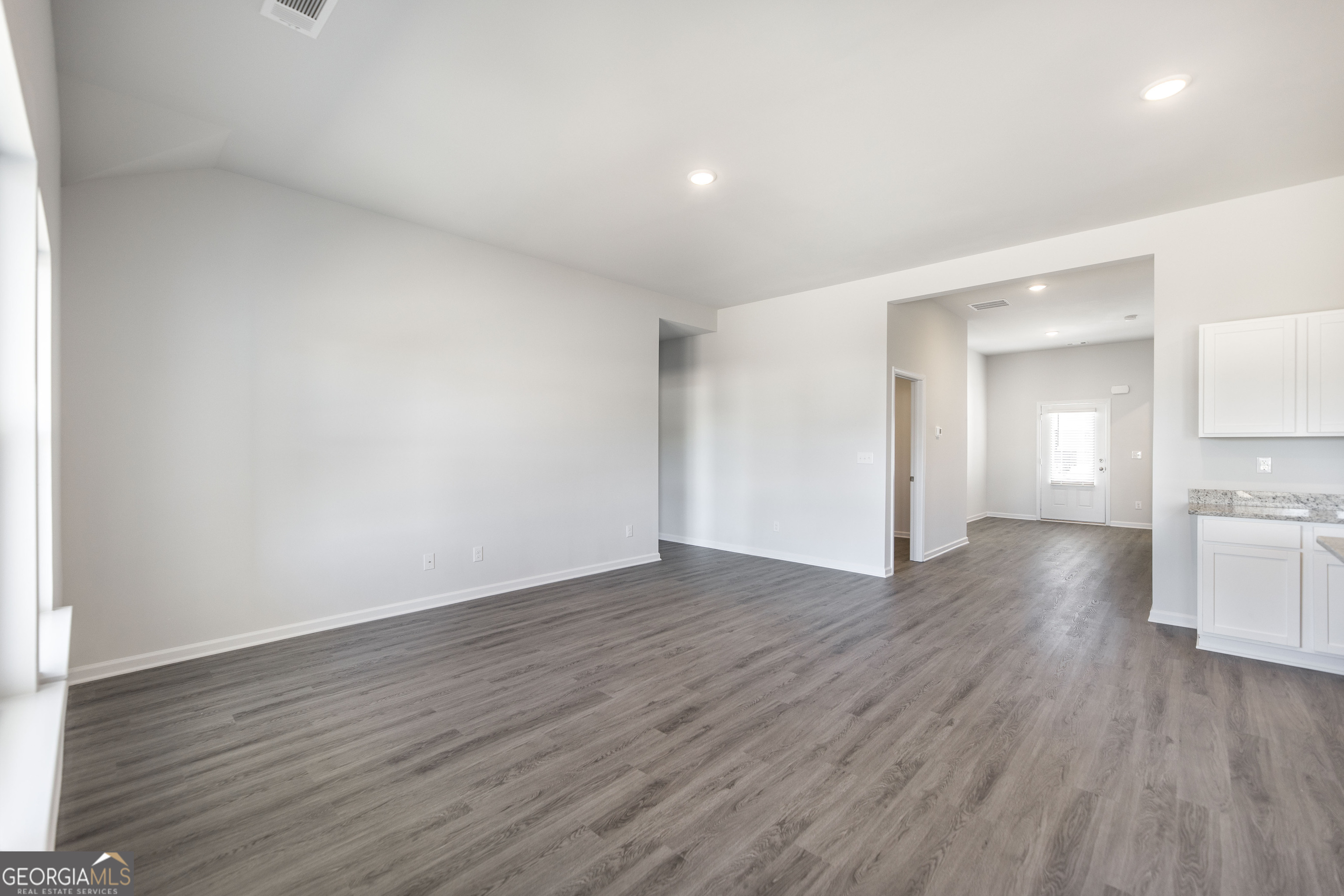502 Georgian Walk Byron, GA 31008 - Photo 11 of 27 a view of empty room with wooden floor