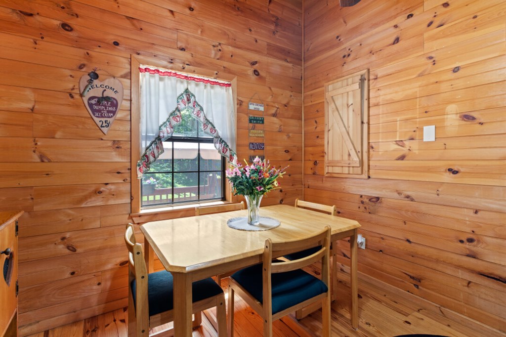 66 Fortenberry Road Young Harris, GA 30582 - Photo 5 of 55 a dining room with a table and chairs
