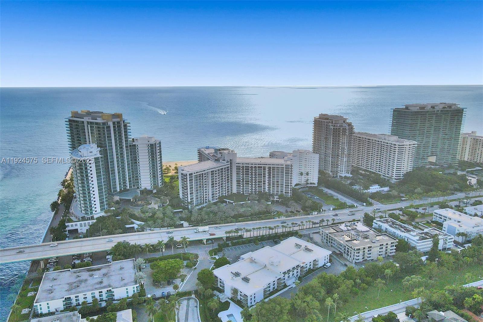 10225 Collins Avenue, Unit 404 Bal Harbour, FL 33154 - Photo 2 of 4 a view of multiple houses with a yard