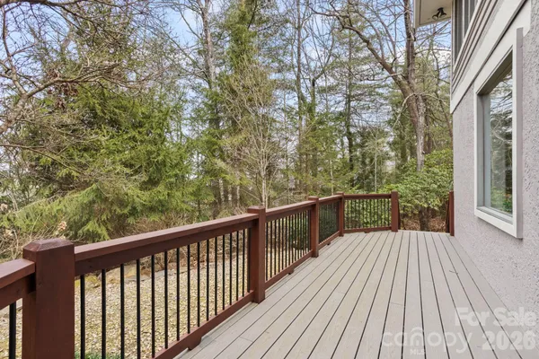a view of backyard with a deck and wooden floor