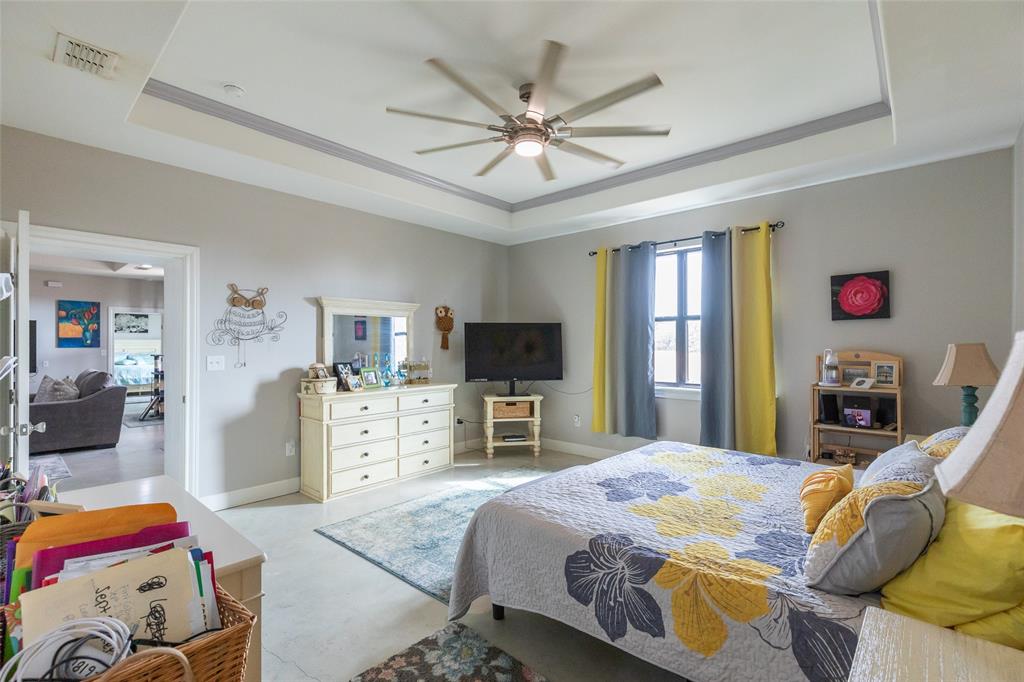 760 Wimberly Road Merkel, TX 79536 - Photo 20 of 35 Tray ceiling with recessed lighting and a ceiling fan
