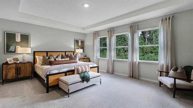 a view of a dining room with furniture and a window