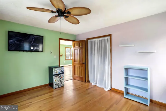 a bedroom with furniture and a window