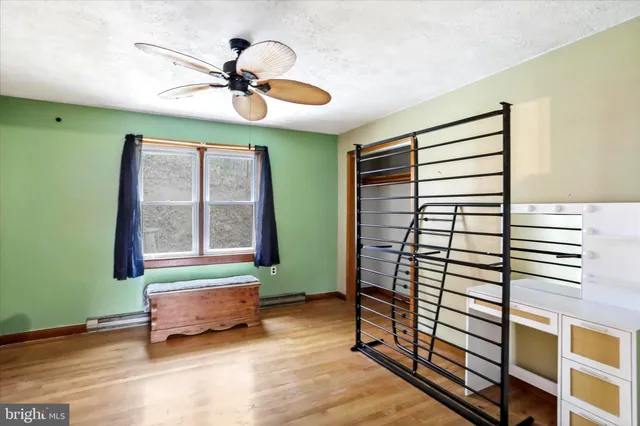 wooden floor in an empty room and a window