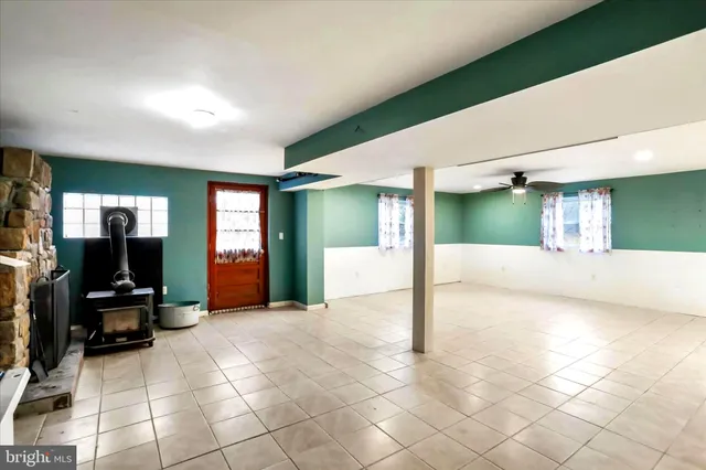 a kitchen with stainless steel appliances kitchen island granite countertop a sink and cabinets