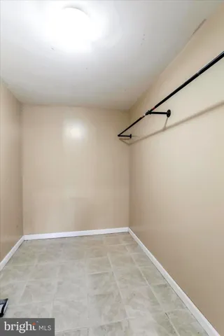 a bathroom with a tub sink and glass door